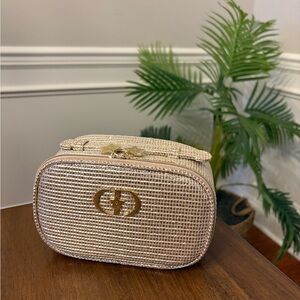 Elegant Gold Dior cosmetic case.